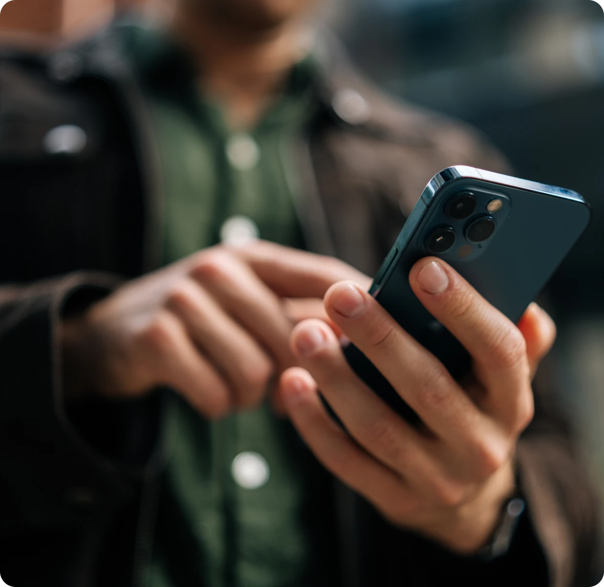 Person using smartphone outdoors